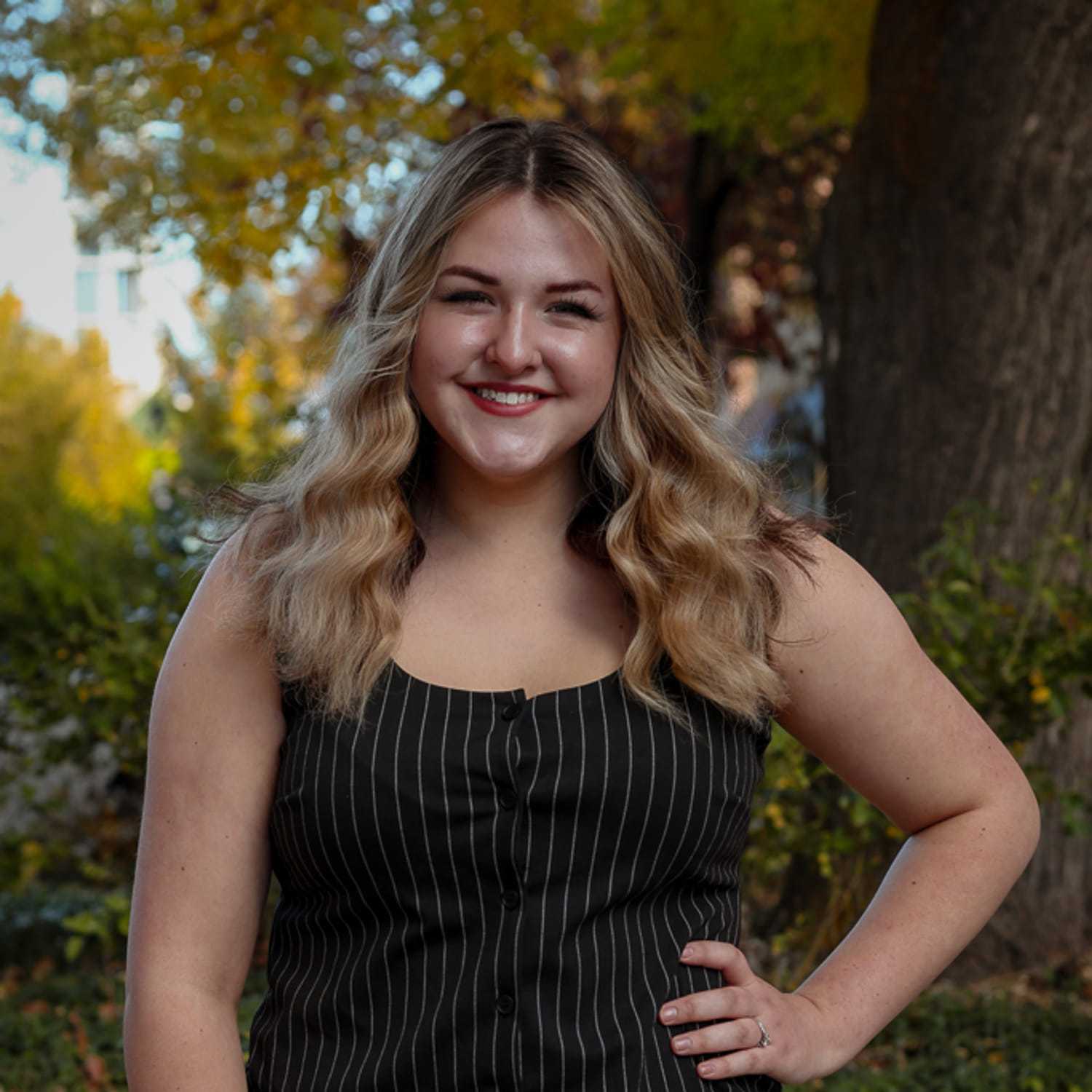 Portrait of Phoebe, a professional stylist at Posh Salon And Boutique, showcasing their expertise and style.