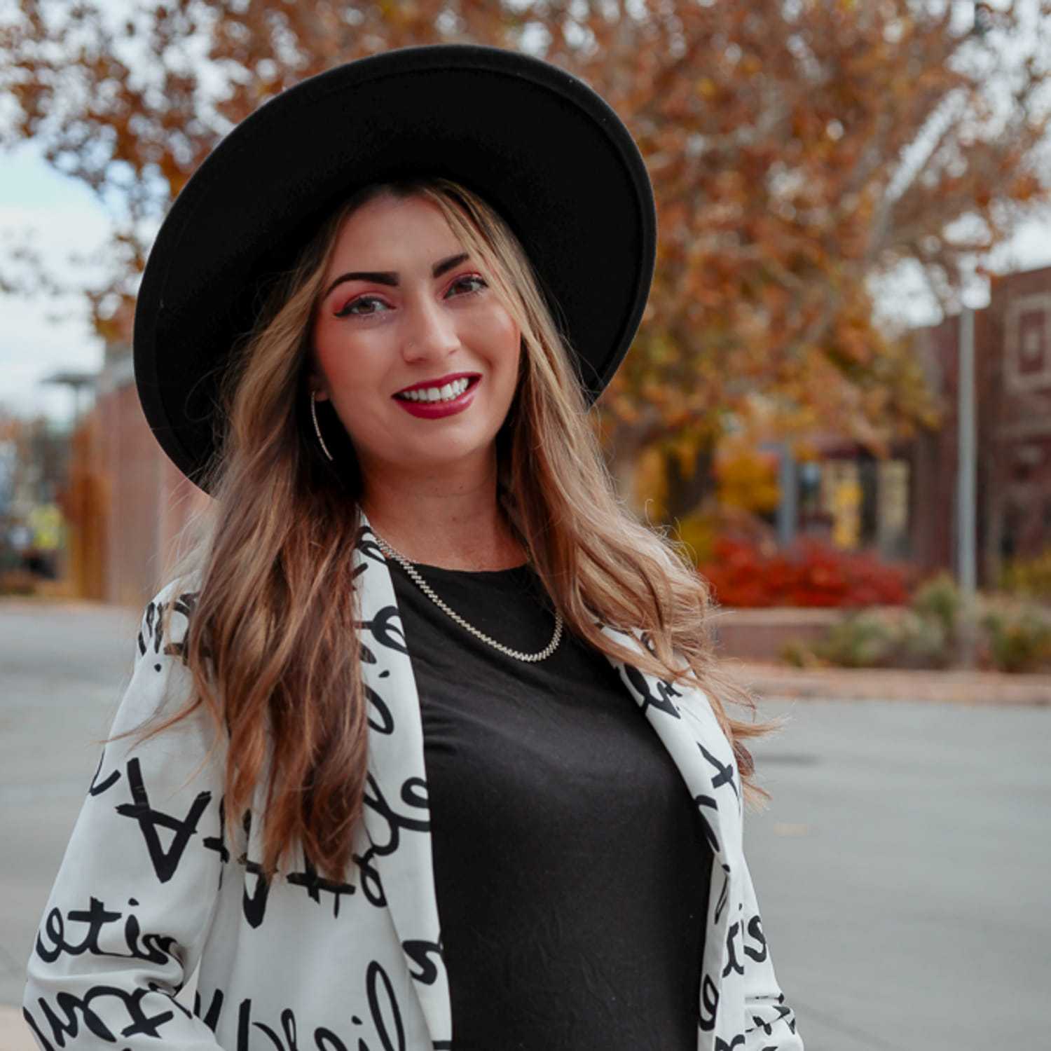 Portrait of Mariah, a professional stylist at Posh Salon And Boutique, showcasing their expertise and style.