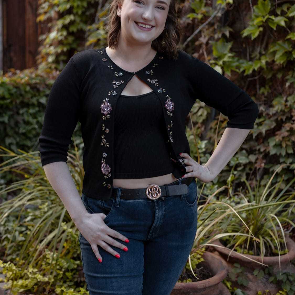 Portrait of Margo, a professional stylist at Posh Salon And Boutique, showcasing their expertise and style.