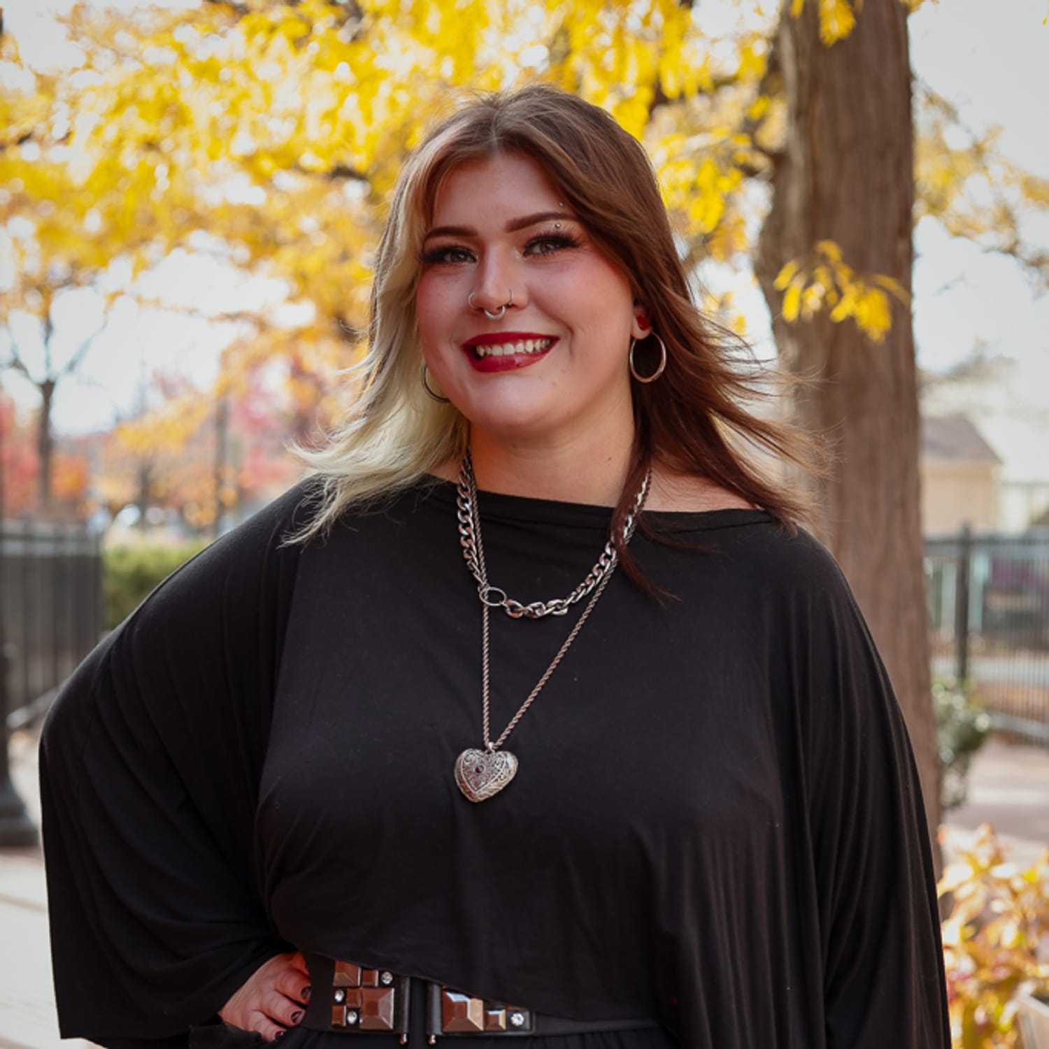 Portrait of Liberty, a professional stylist at Posh Salon And Boutique, showcasing their expertise and style.