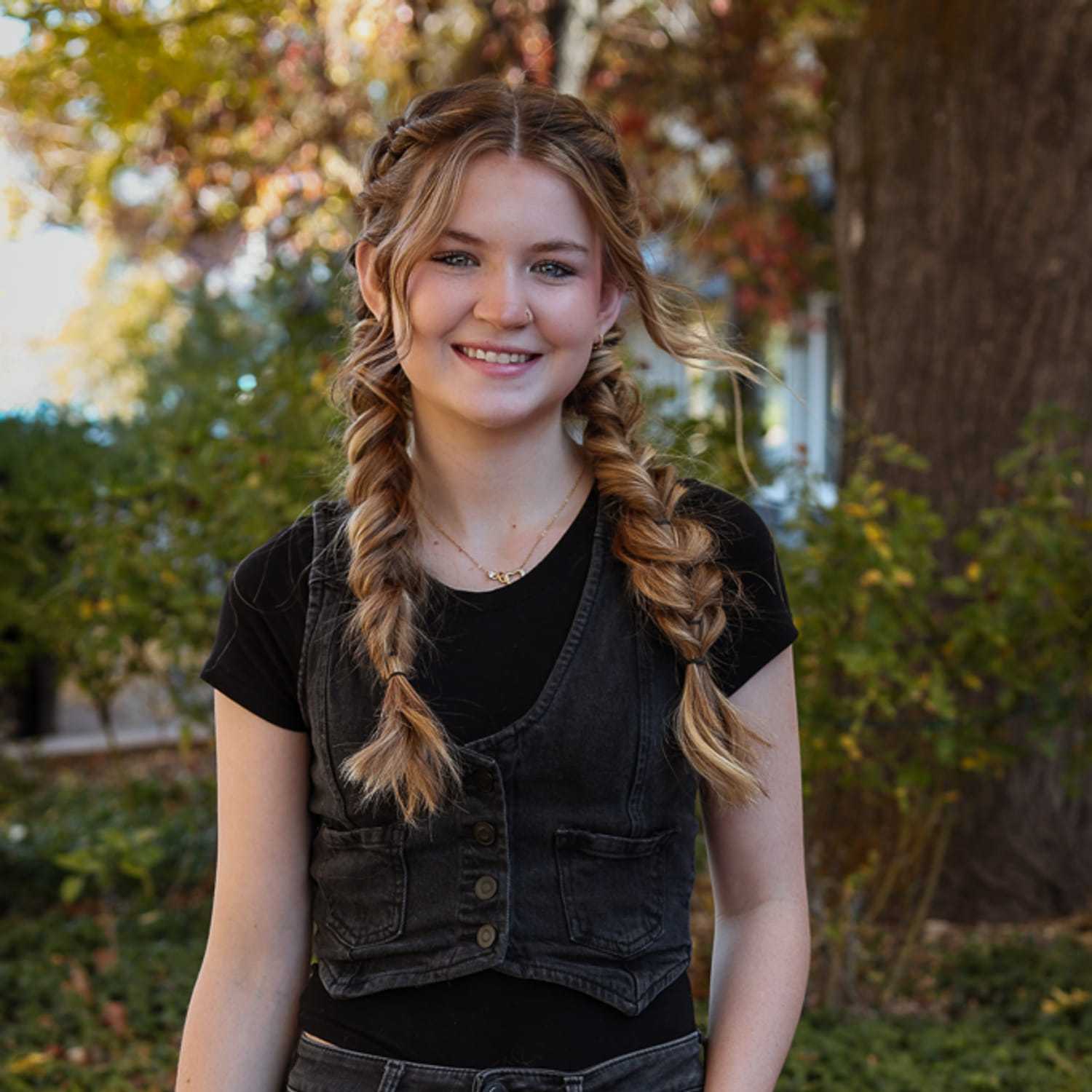 Portrait of Cameron, a professional stylist at Posh Salon And Boutique, showcasing their expertise and style.